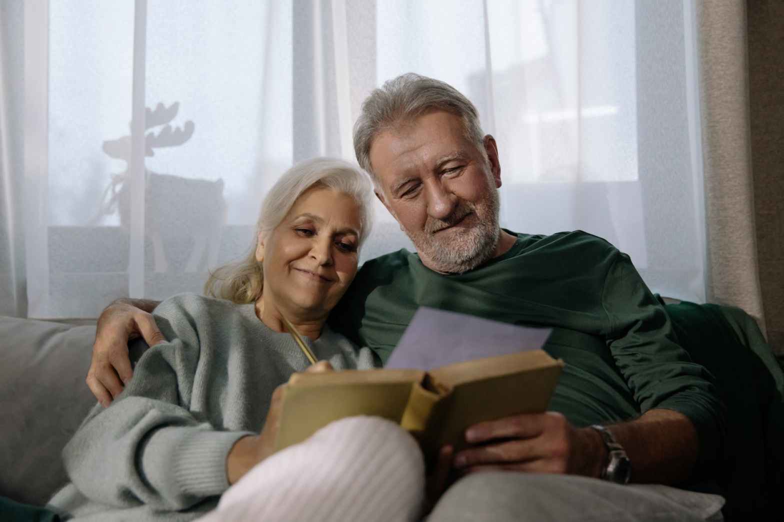 retired couple reading book